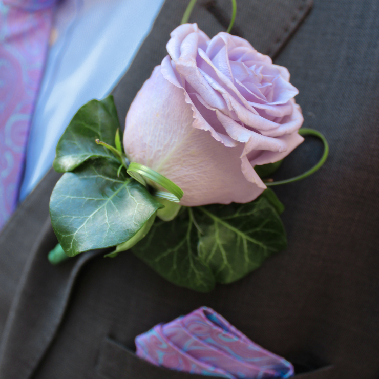 Dusty mauve roses wedding boutonniere.