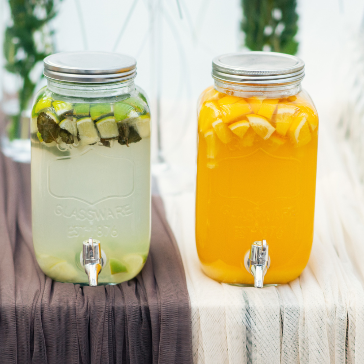 Bride to bee bridal shower refreshments of glass drink dispensers with lime drink and orange juice.