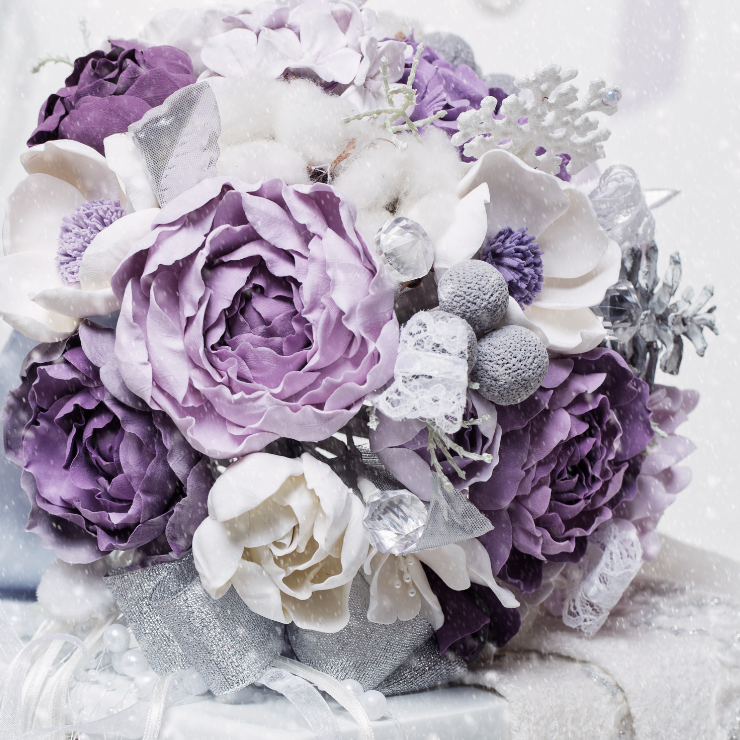 Dusty mauve wedding bridal bouquet with roses and silver embellishments.