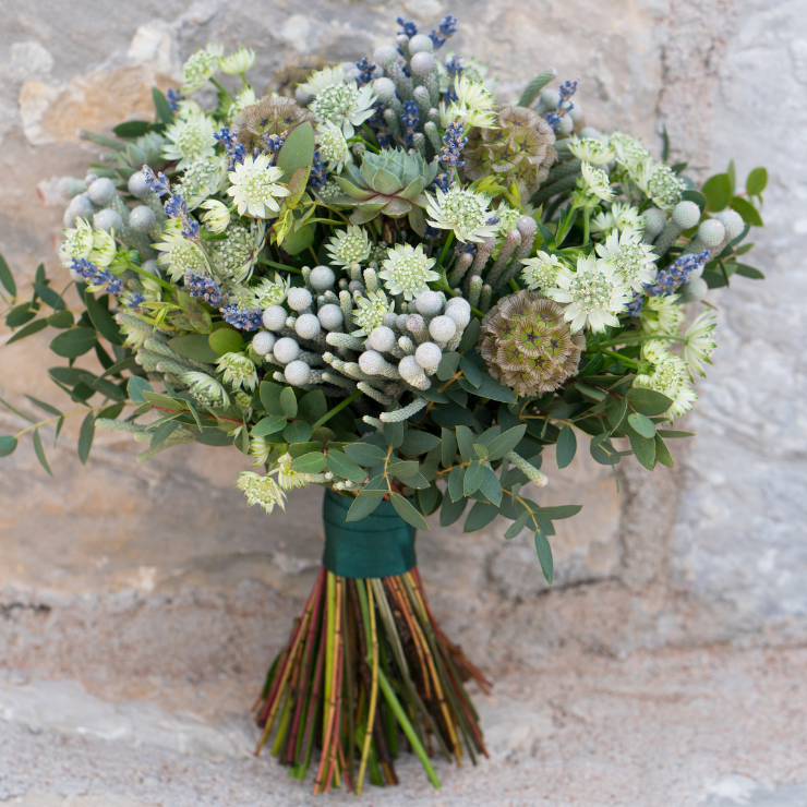 Sage green wedding bridal bouquet with lavender, cactus and foliage.