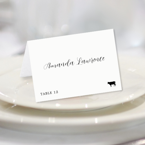 Folded wedding place card with beef meal option, table number and personalized name in modern script typography.