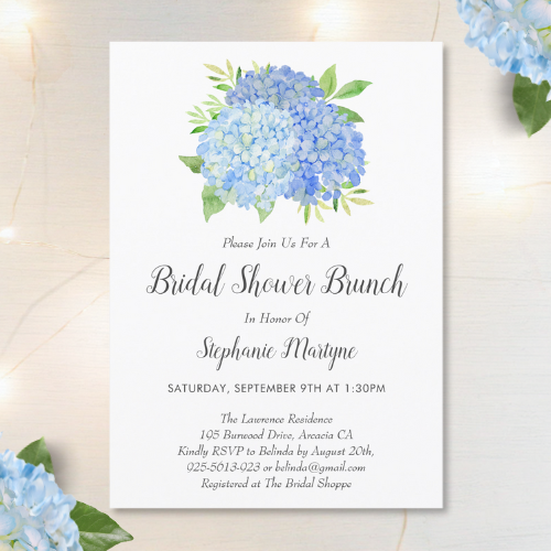 Blue hydrangea bridal shower brunch invitation with modern watercolor blue hydrangea bouquet with foliage and script typography.