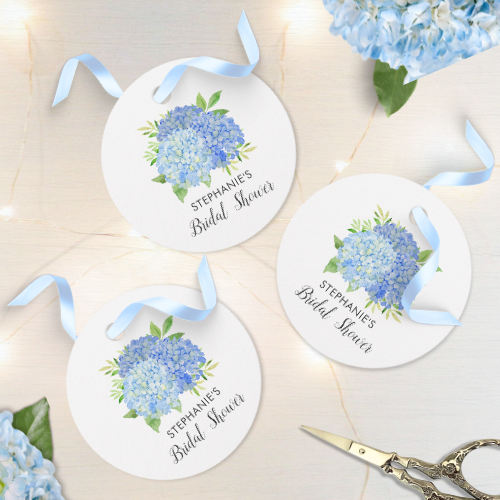 Blue hydrangea bridal shower round favor tags with modern watercolor blue hydrangea bouquet with foliage and script typography.