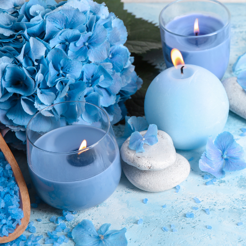 blue hydrangea flower with candles and petals