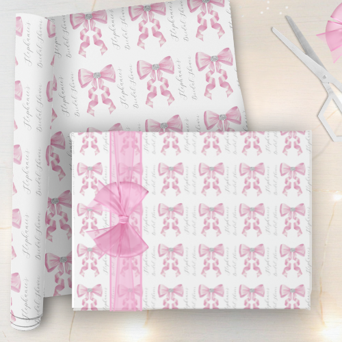 Shes tying the knot bridal shower coquette themed wrapping paper featuring a chic glam silky pink bow with sparkling rhinestones design and customizable modern script typography.