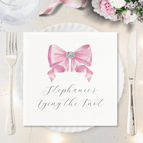 Shes tying the knot bridal shower coquette themed napkin featuring a chic glam silky pink bow with sparkling rhinestones design and customizable modern script typography.