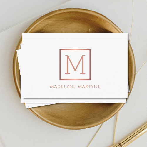 Elegant classy minimalist white business cards with rose gold style monogram logo in clean modern typography font.