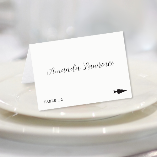 Folded wedding place card with vegetarian meal option, table number and personalized name in modern script typography.